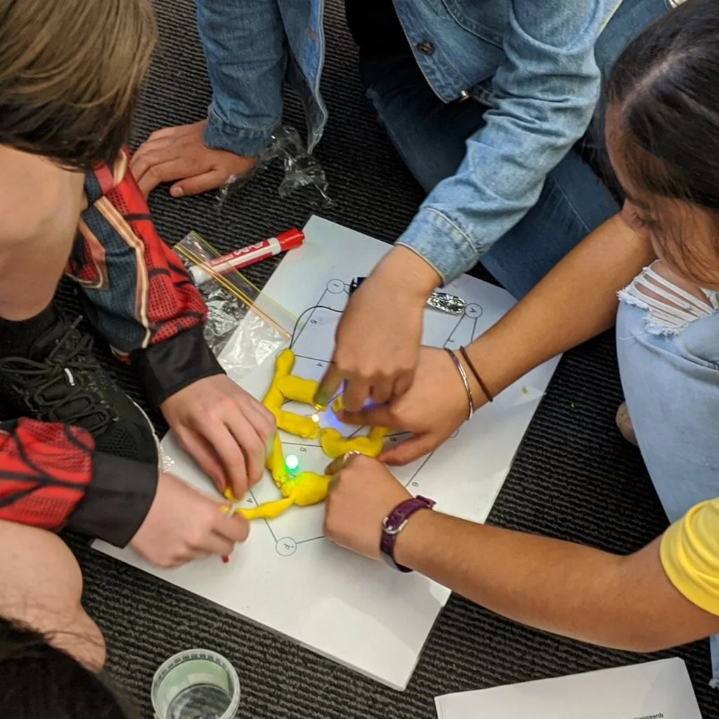 Community of learners at a coding workshop